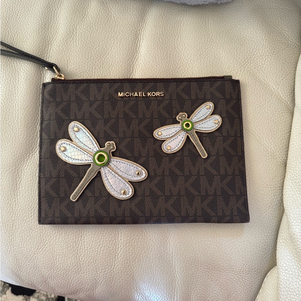 Michael Kors Large Wristlet 
Almost new 
Size-9.5 x 7 inches 
Card slots inside